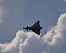 Typhoon 1 Typhoon high in the sky with jet trail.